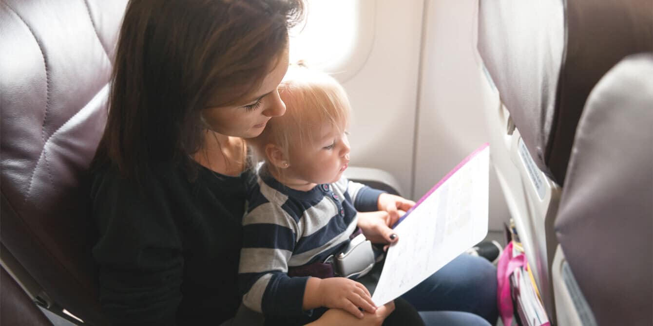 mom and baby on airplane - tips for flying with a baby