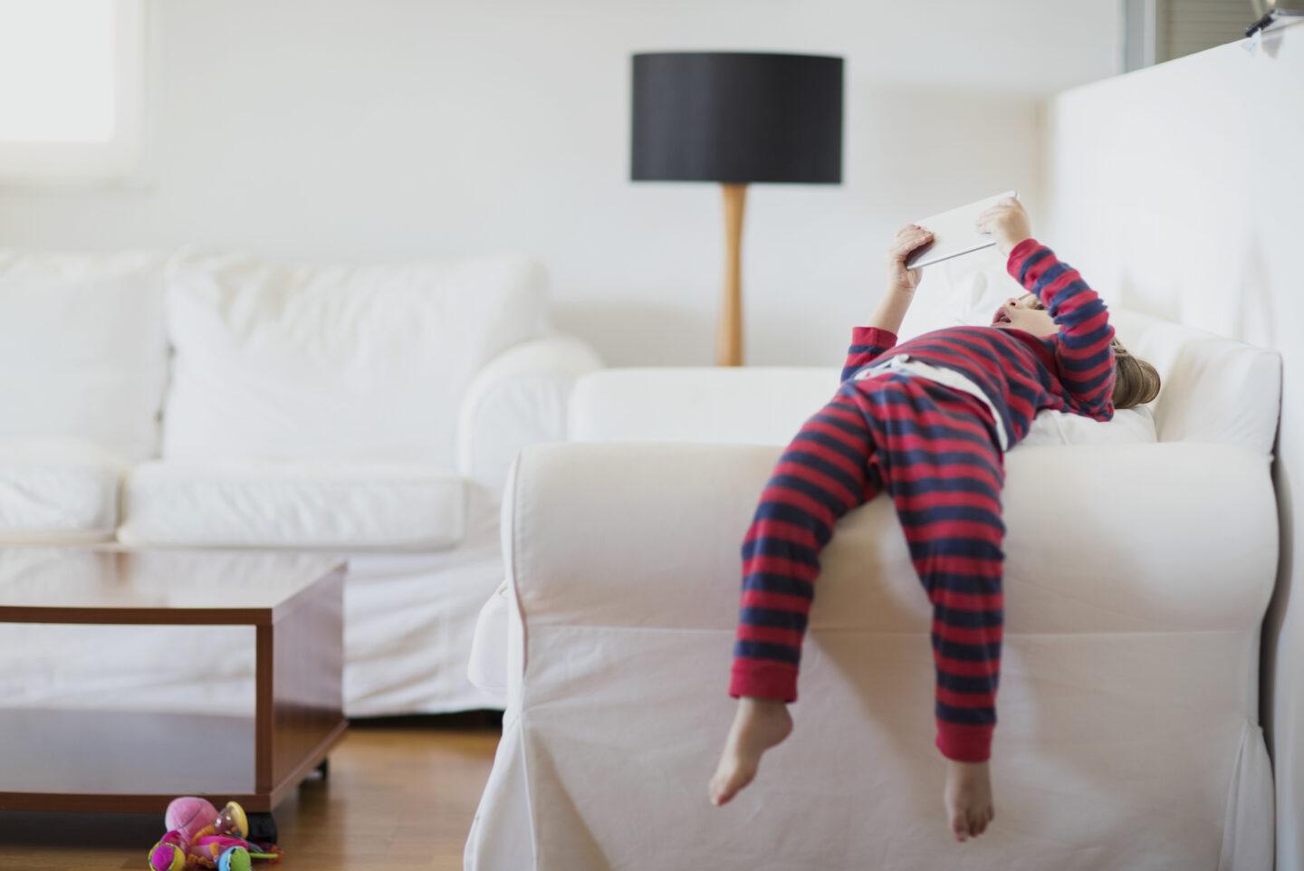 screentime and your baby: 2 year old boy using a digital tablet