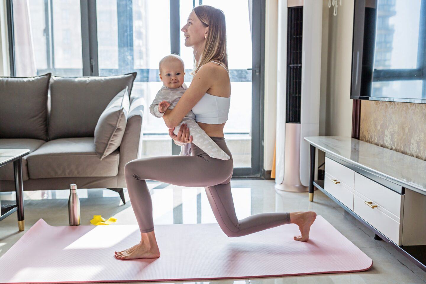 mom doing yoga with baby