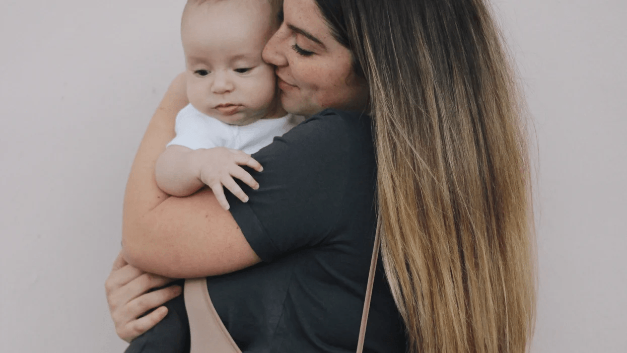 mom hugging baby