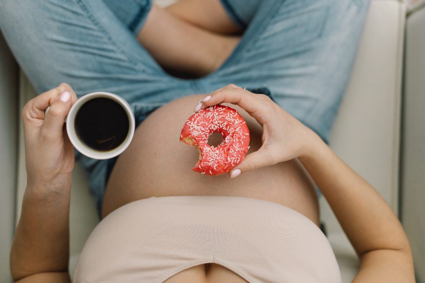 pregnant woman eating sweet treat