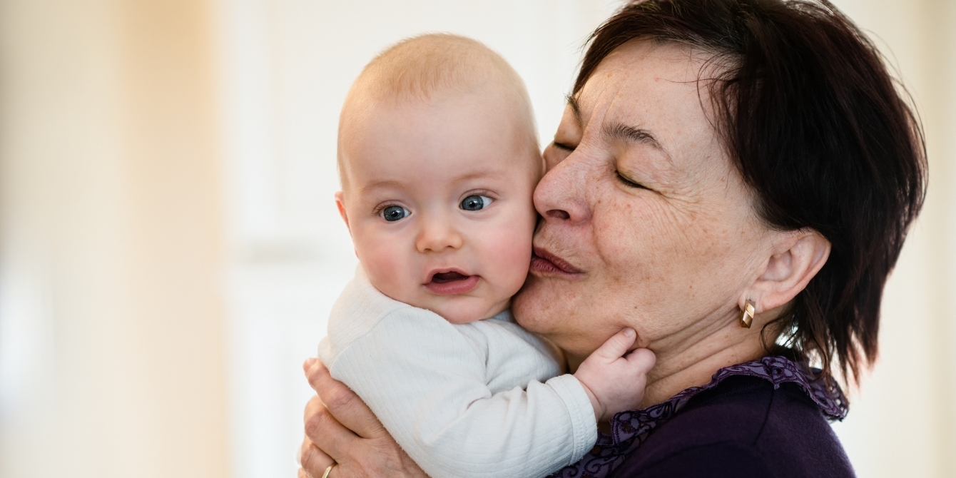 grandma kissing baby on cheek- grandparent boundaries