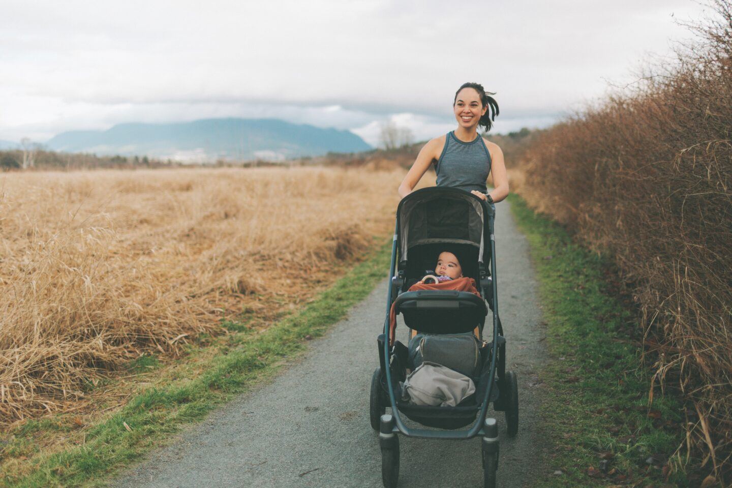 Mom jogging with stroller