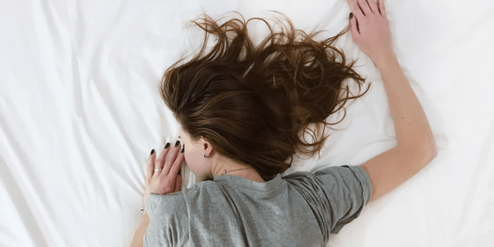 woman sleeping on the bed