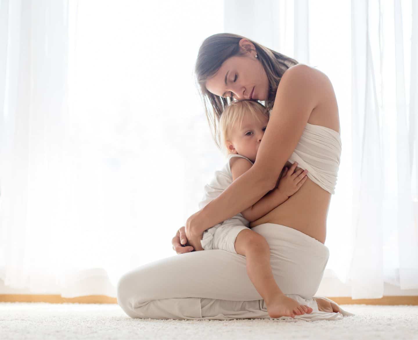 mother breastfeeding toddler