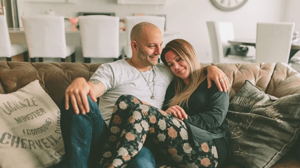 couple snuggling on the couch