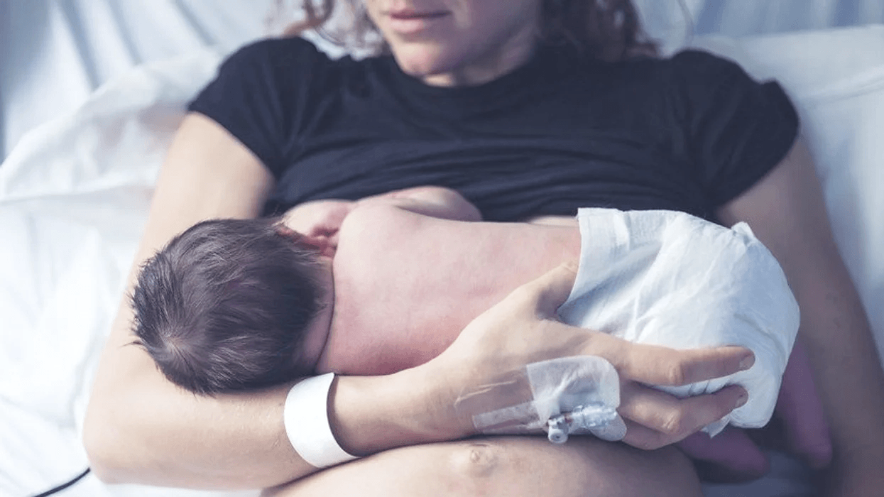 woman breastfeeding baby in the hospital