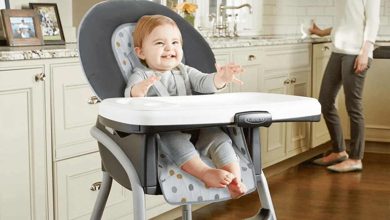 baby sitting in a high chair