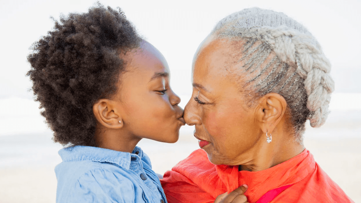 child kissing grandma on the nose