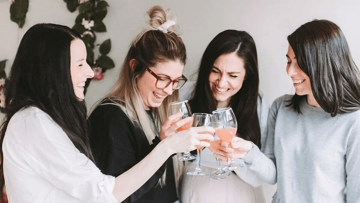 mom friends clinking glasses