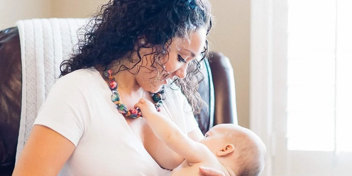 mom breastfeeding baby