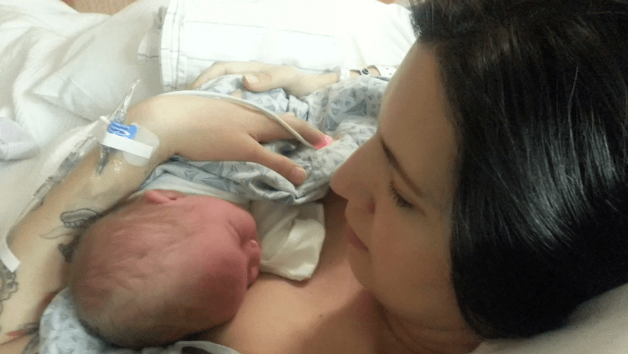 woman holding newborn baby in a hospital