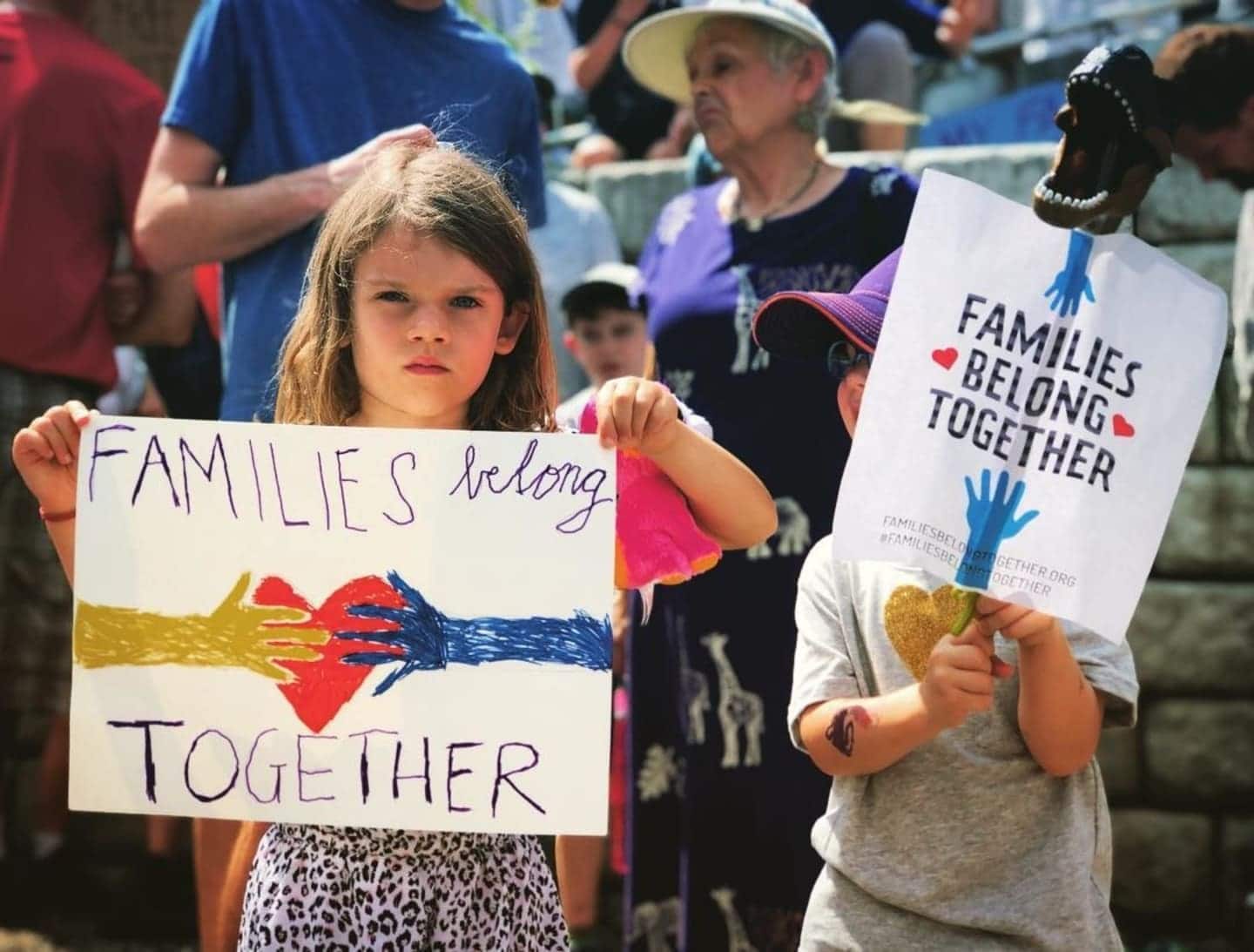 child holding a poster