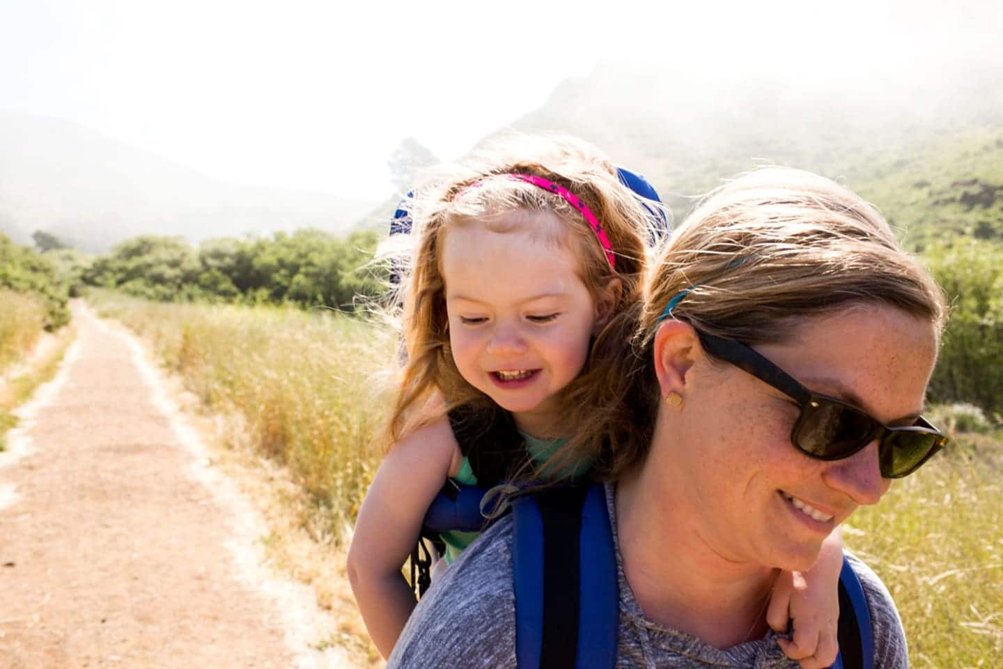 woman carrying a child on her back