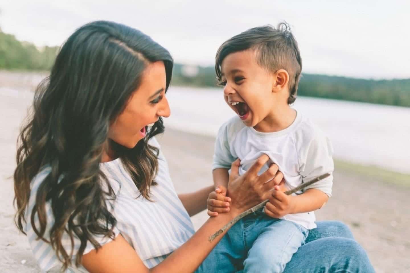 mom tickling her child