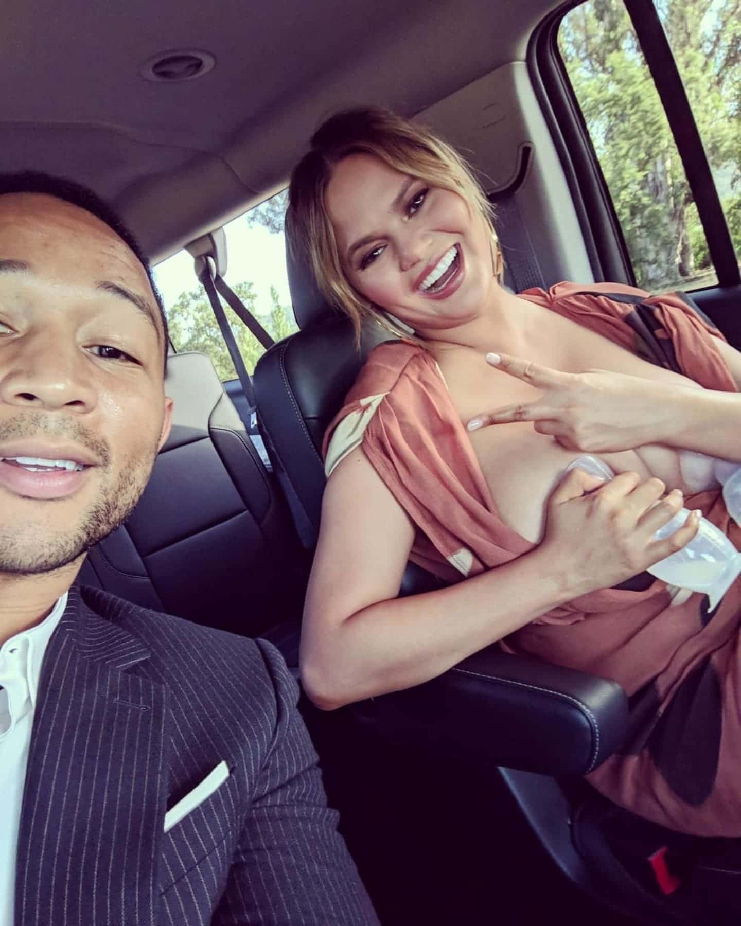 chrissy teigen using breast pumps in car proves mamas are always multi tasking featured Motherly