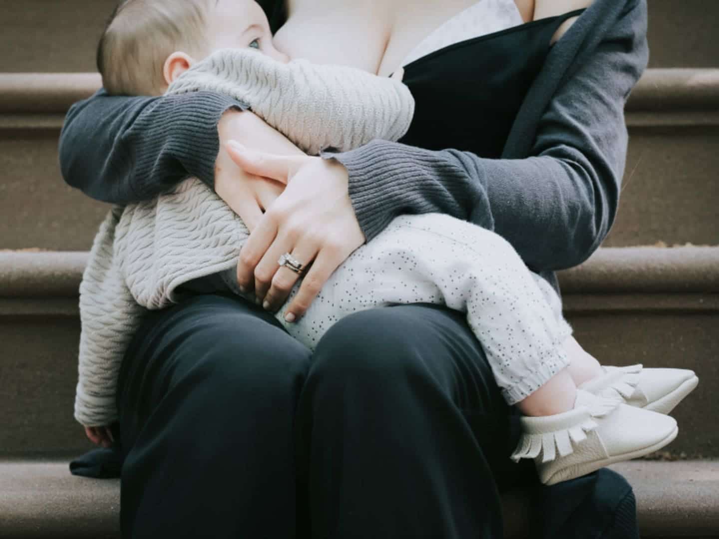 a mother breastfeeding her baby