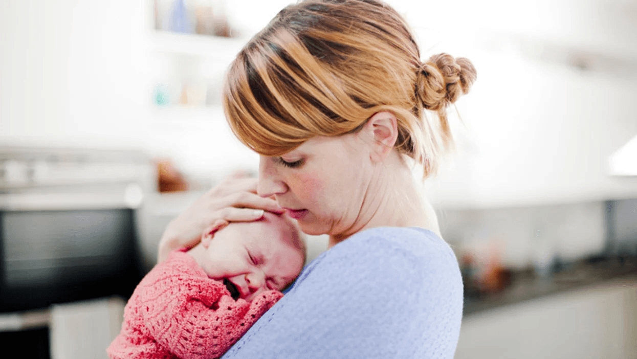 mom comforting crying baby