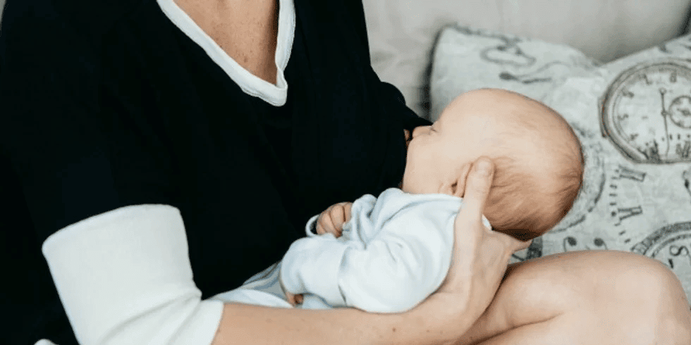 mom breastfeeding baby