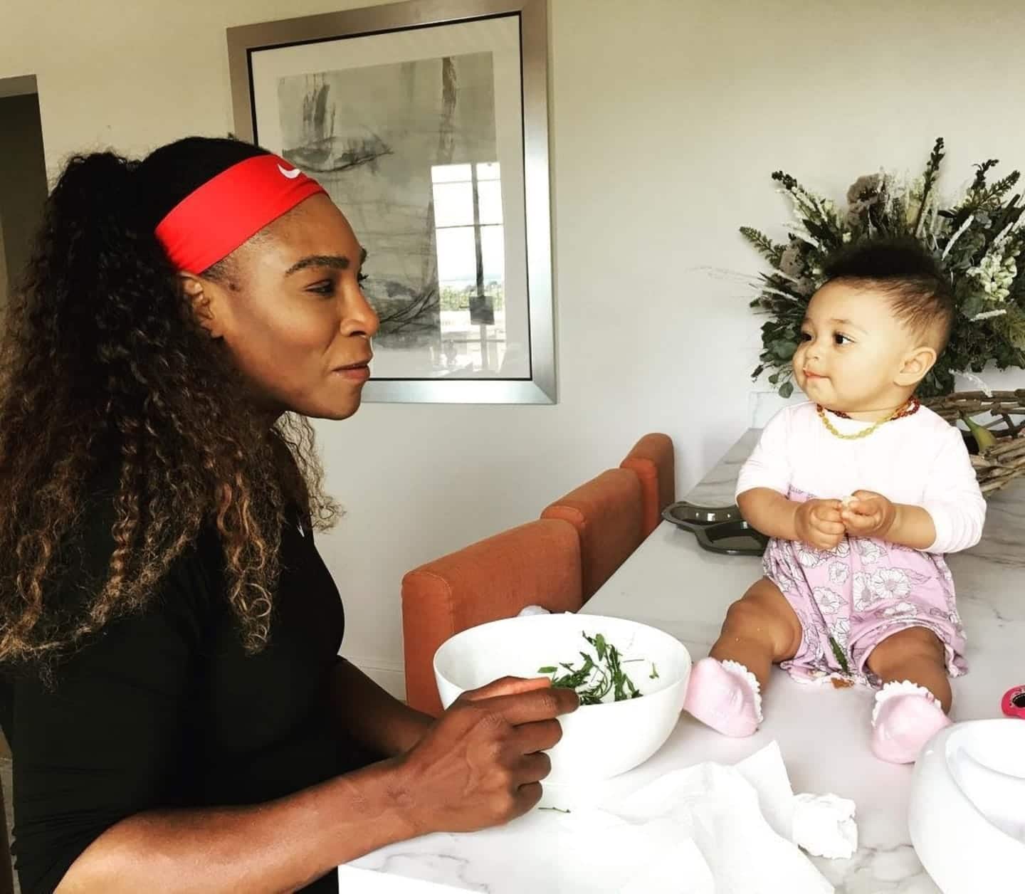 Serena Williams eating with baby