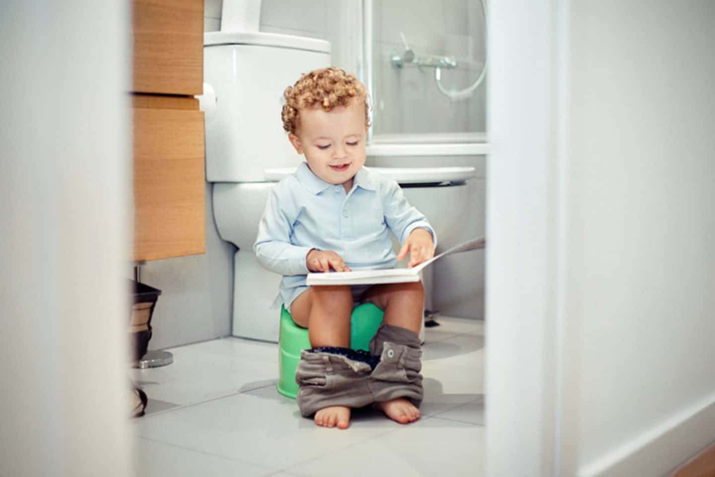 toddler reading while potty training