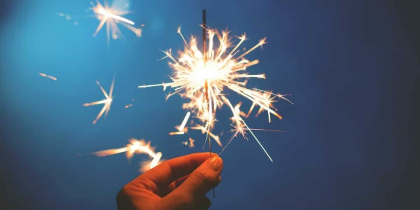 Hand holding a sparkler