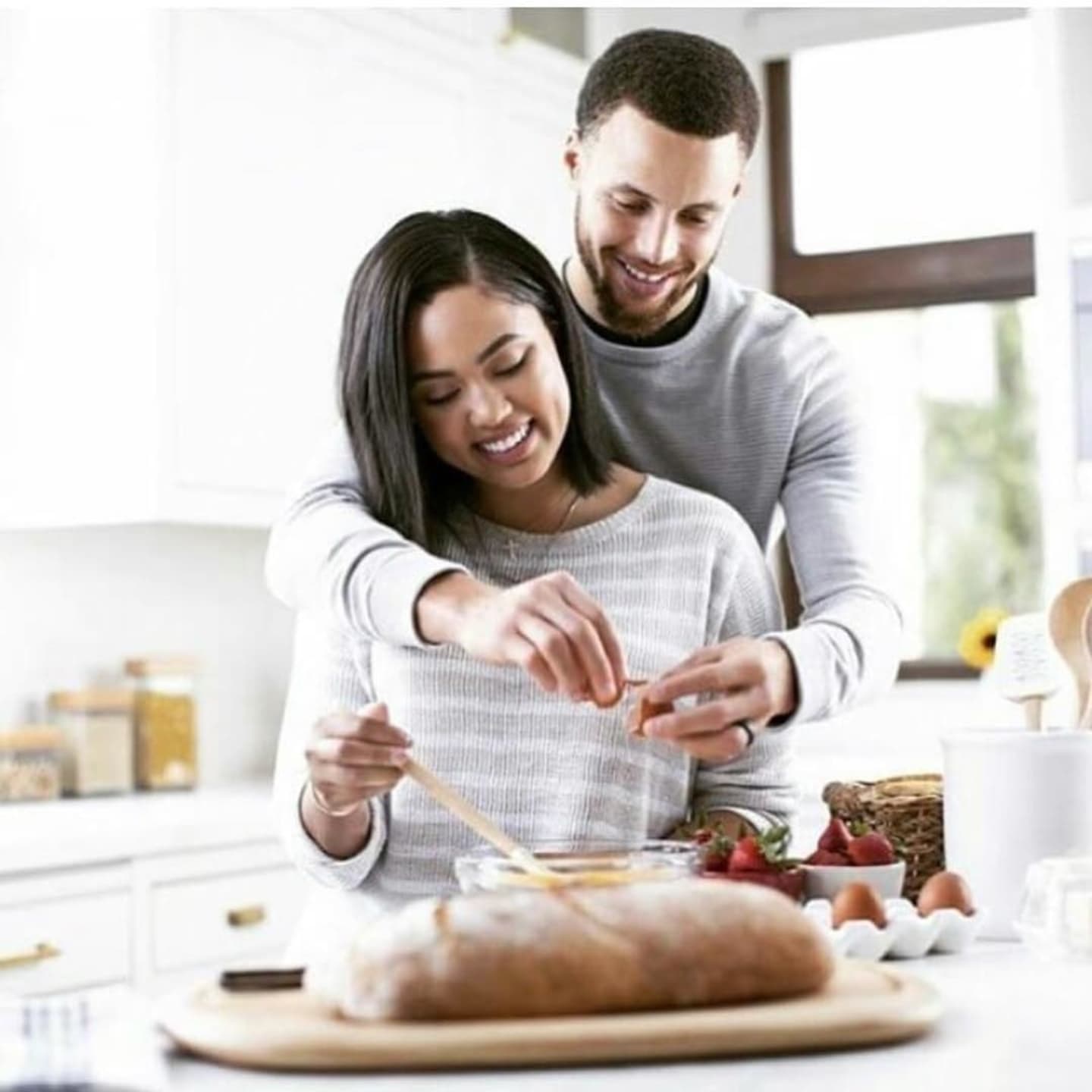 Ayesha and Steph Curry cooking in the kitchen