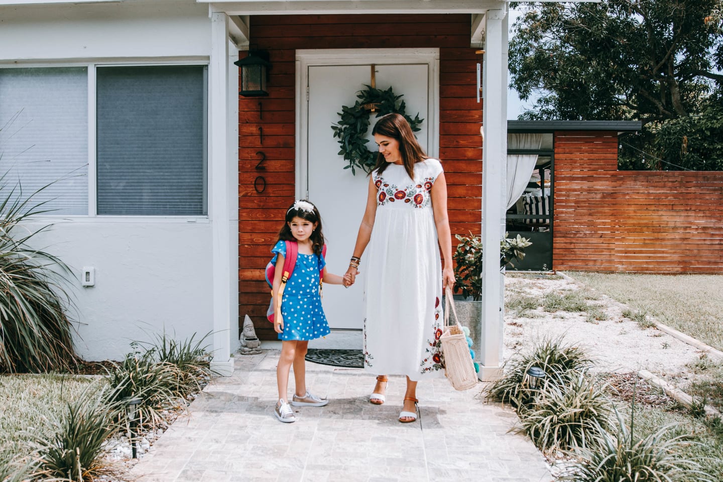 mom and daughter walk out the door