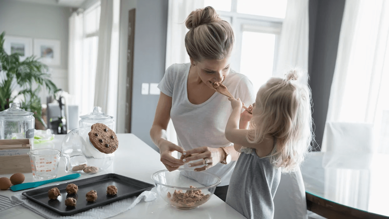 mom and daughter baking cookies