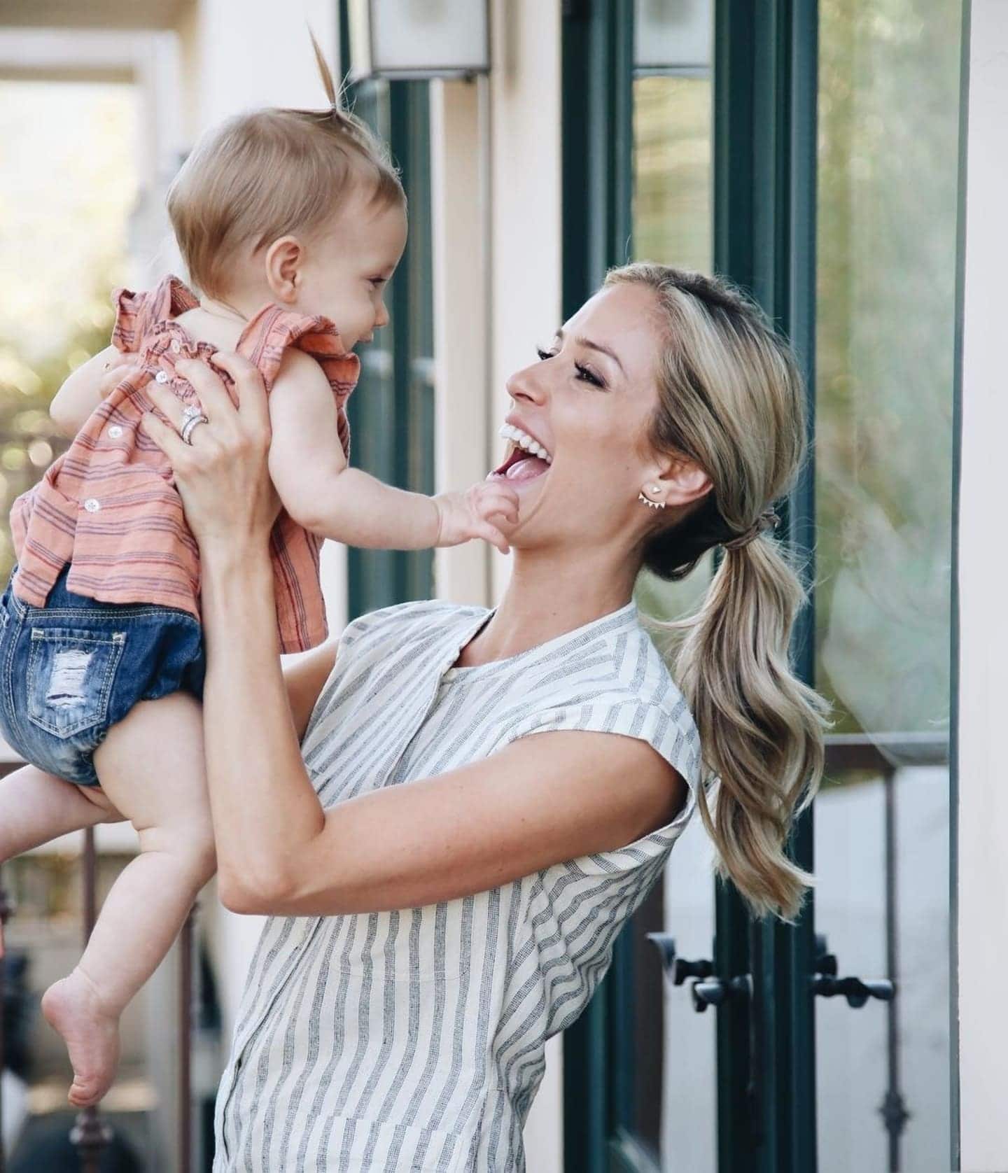 Kristin Cavallari carrying her child