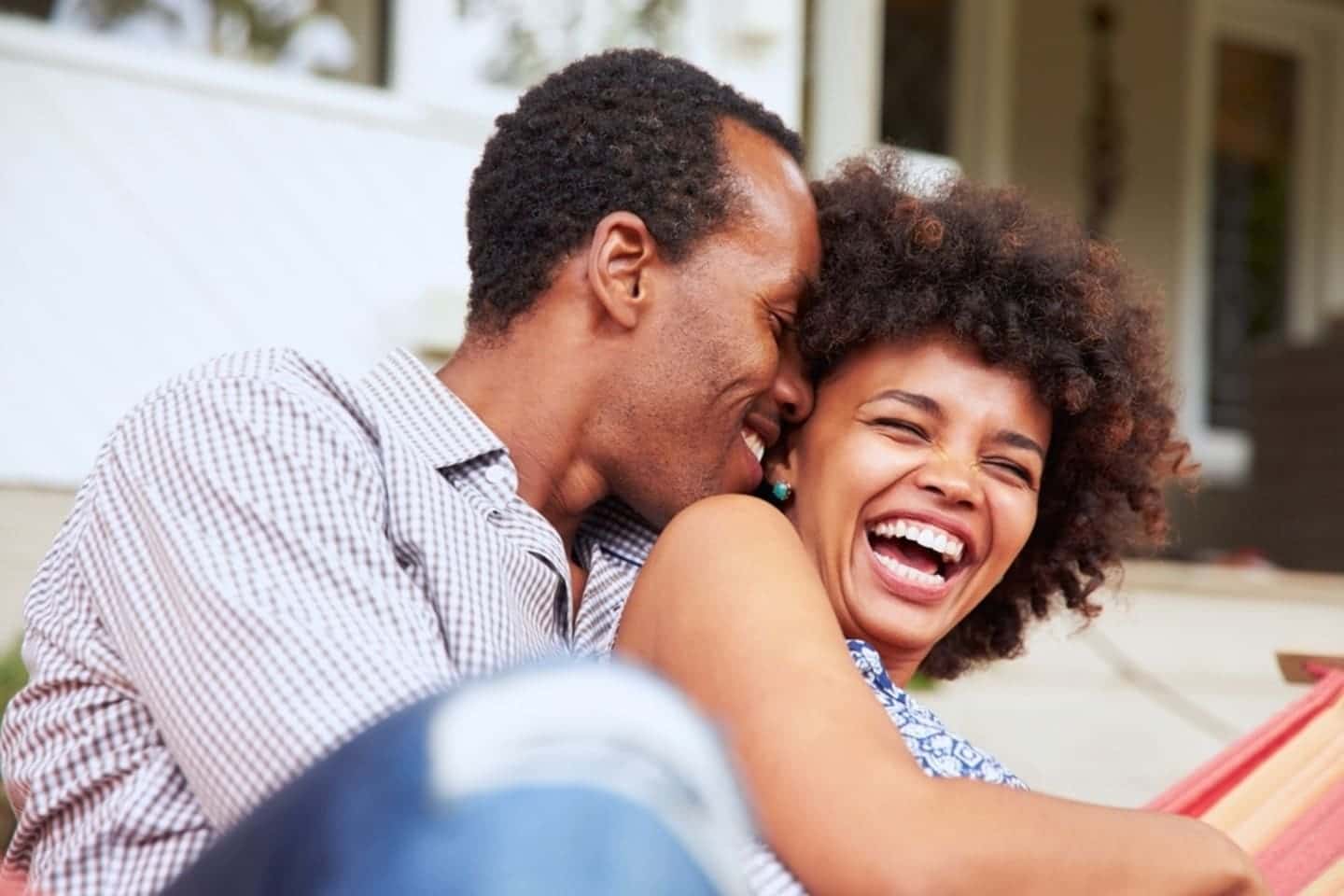 man and woman laughing