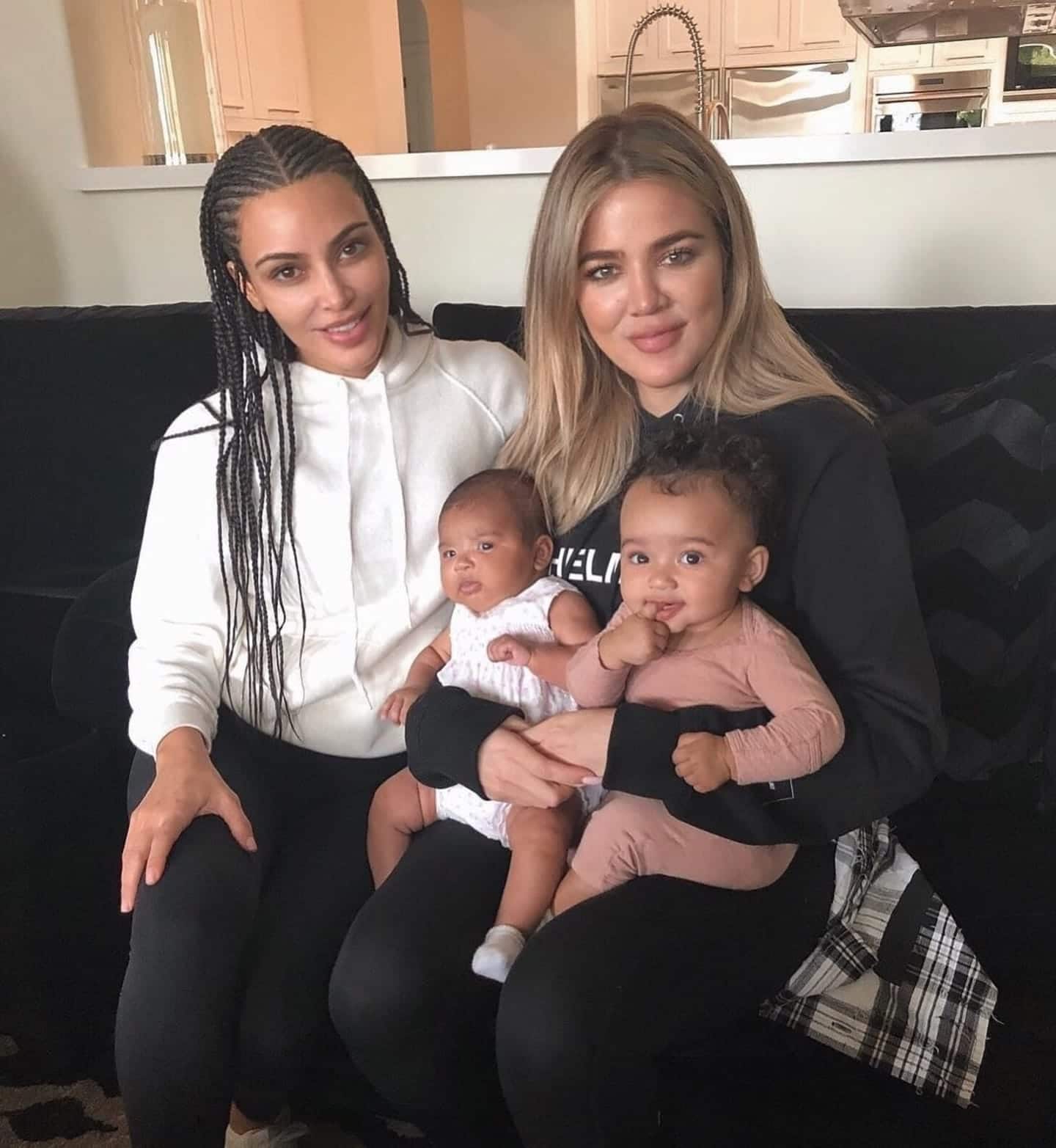 Khloe and Kim Kardashian with their babies