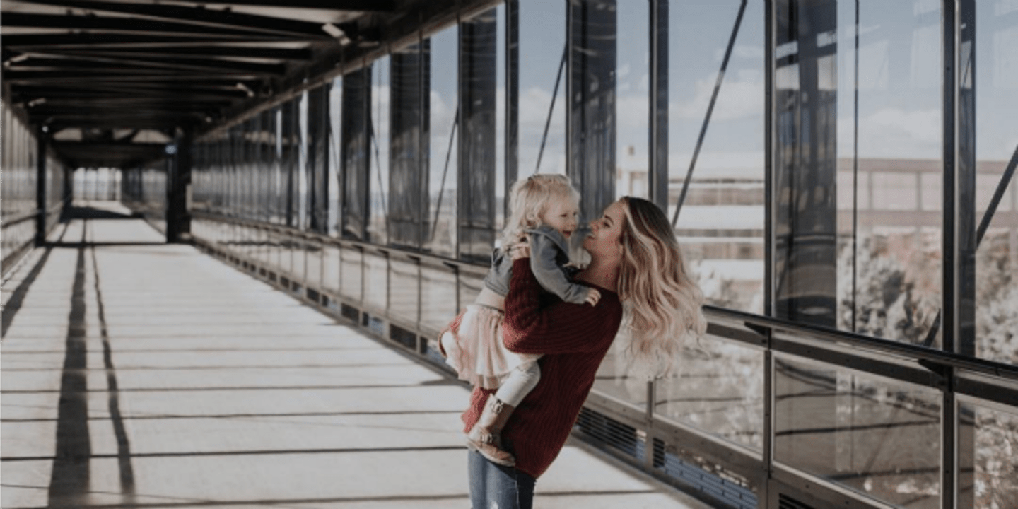 woman carrying a toddler