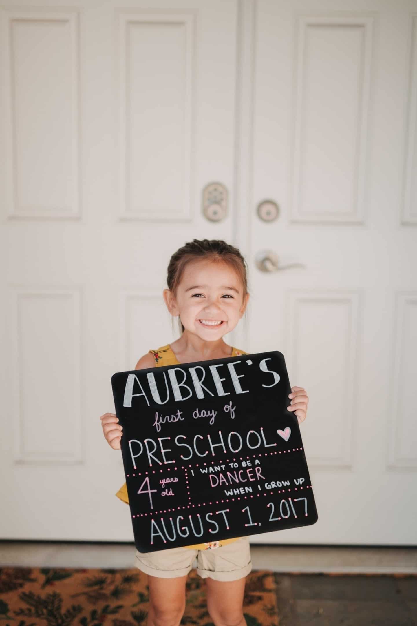 child holding a poster