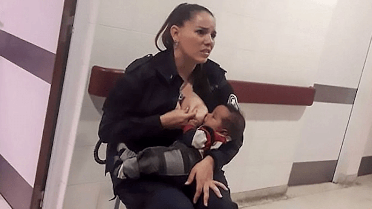 female police woman breastfeeding a baby