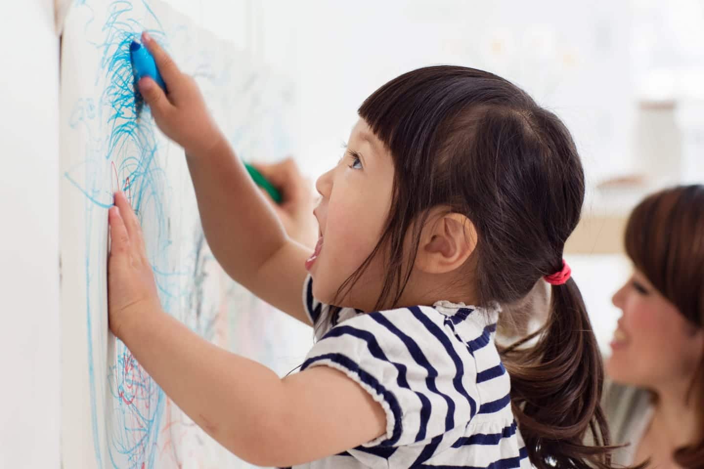 Child drawing on the wall