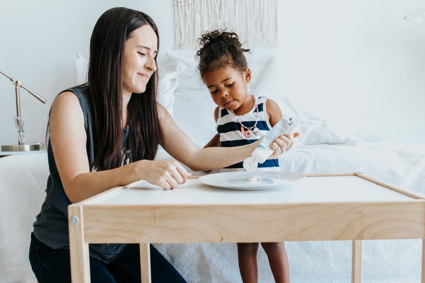 mom and child in front of a table