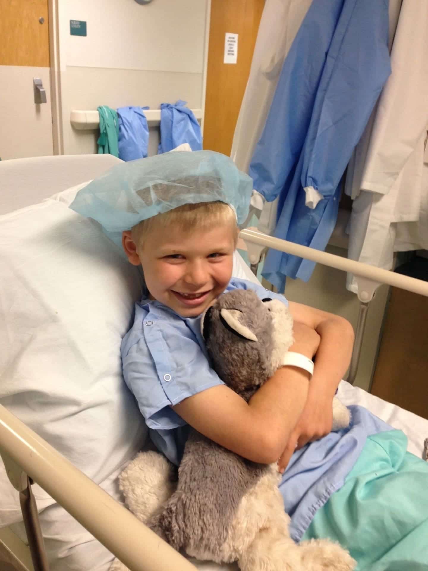 Child wearing hospital gown