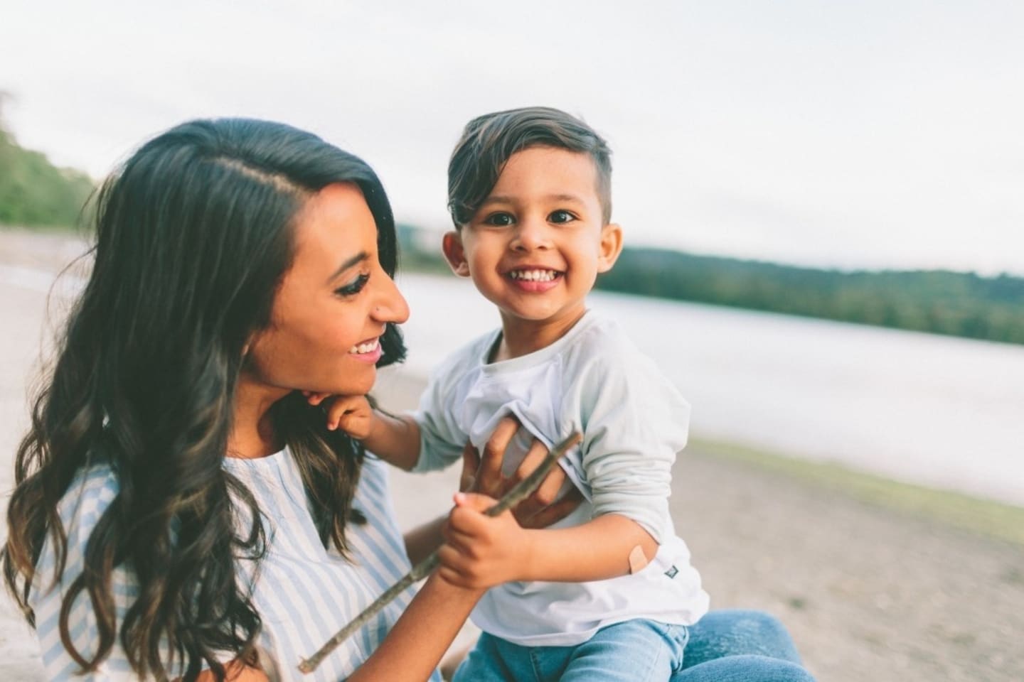 child sitting on a woman's lap