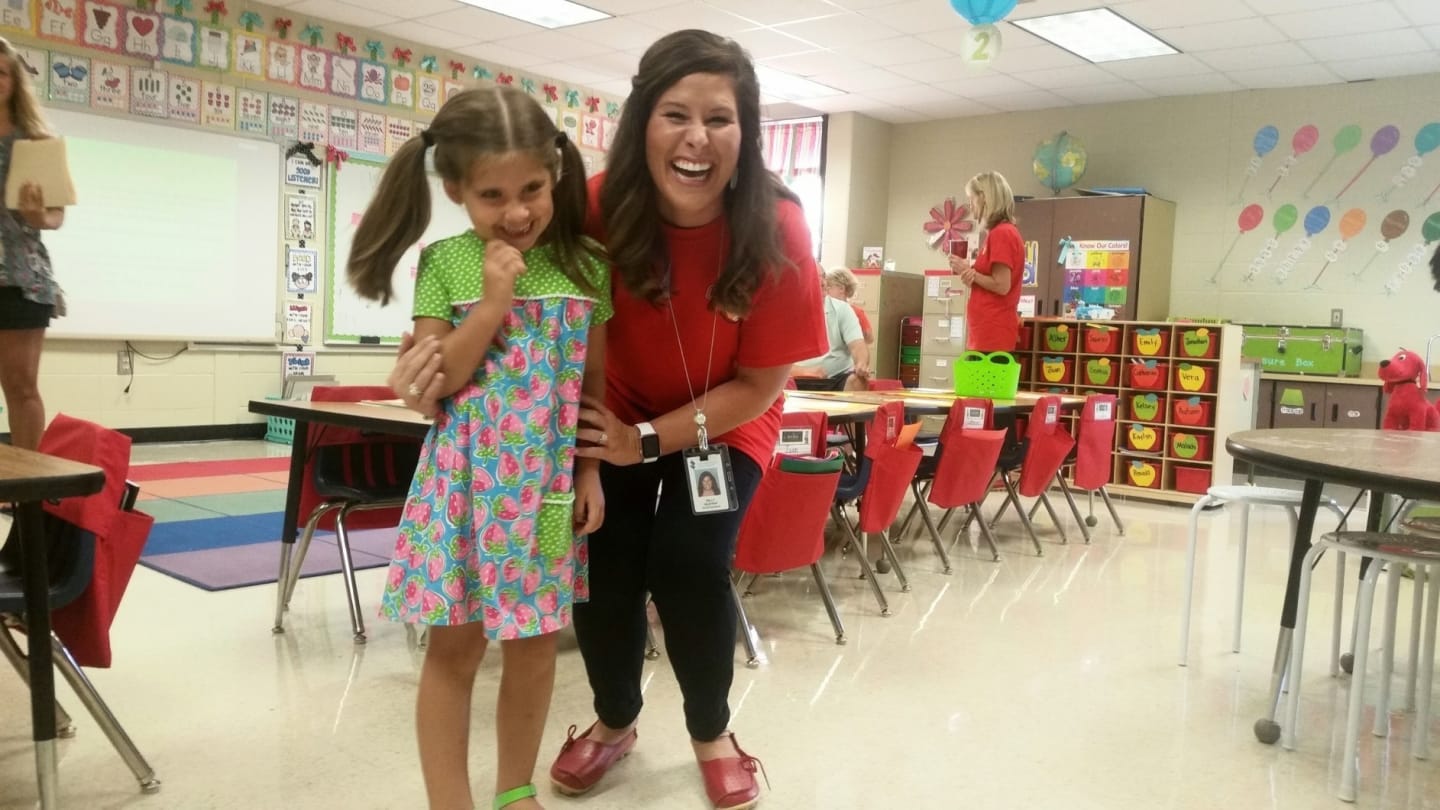 child with her teacher