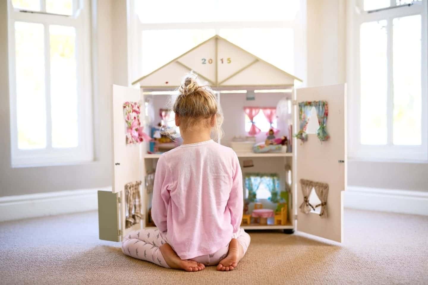 girl playing with her toys