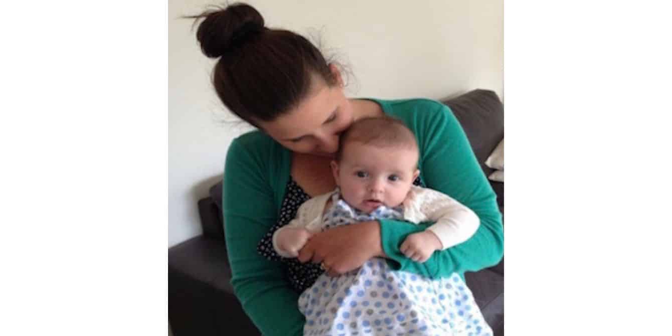 mom with postpartum bipolar disorder holding her baby