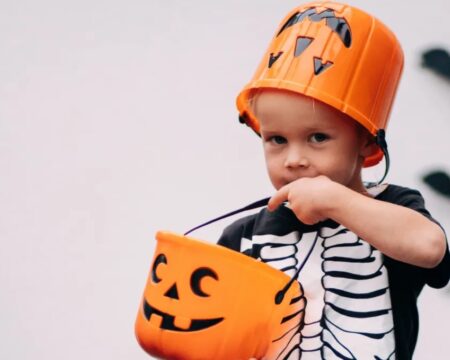 boy holding a pumpkin Motherly
