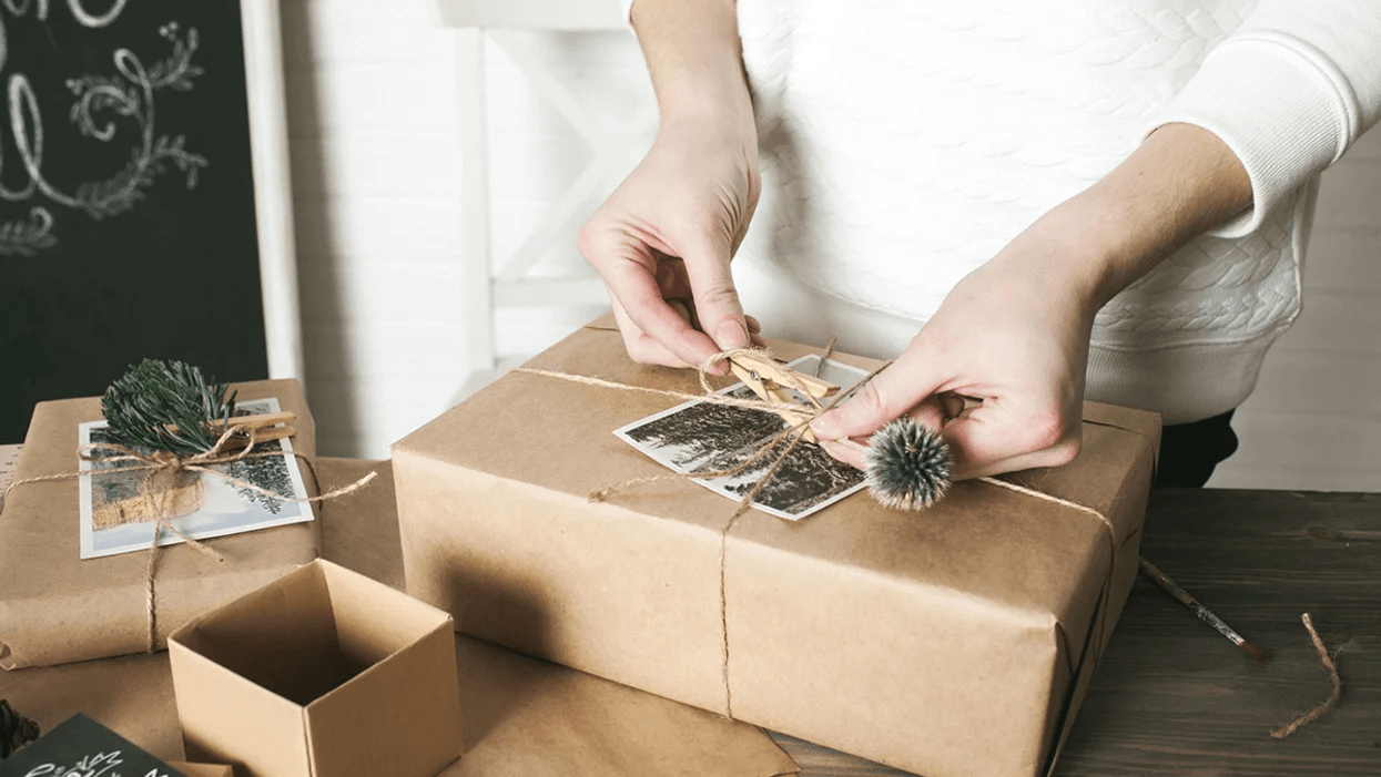 woman wrapping gift