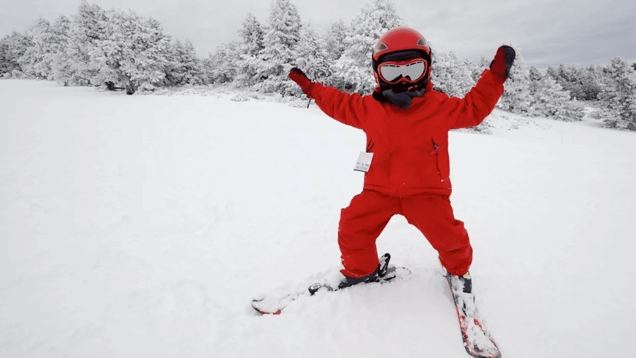 little kid snowboarding