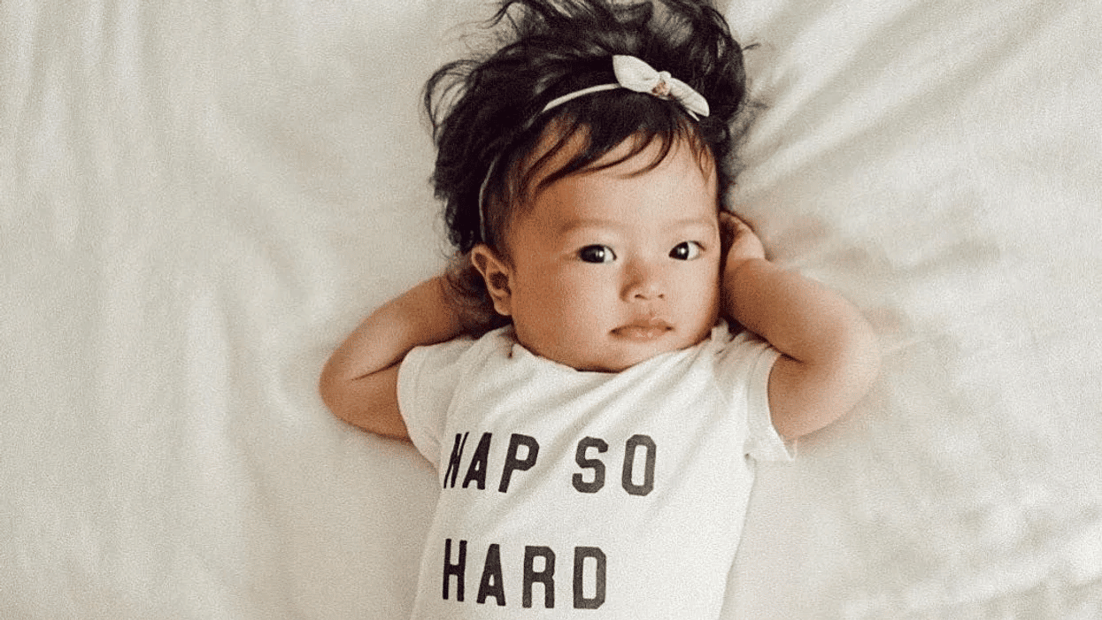 little-girl-laying-on-a-bed