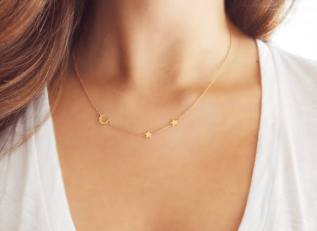 woman wearing gold necklace