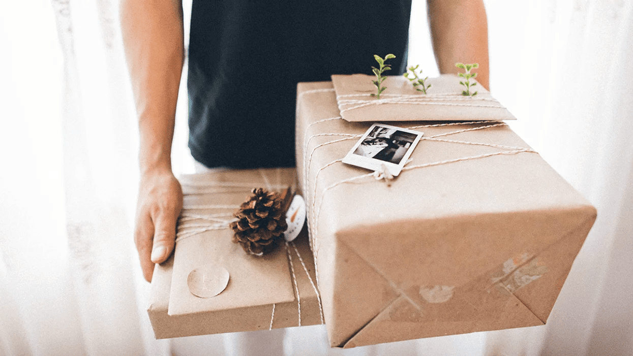 dad carrying wrapped gifts