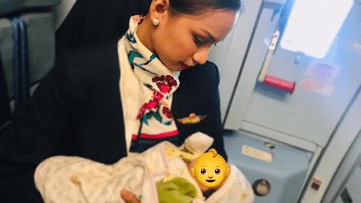 flight-attendant-holding-baby