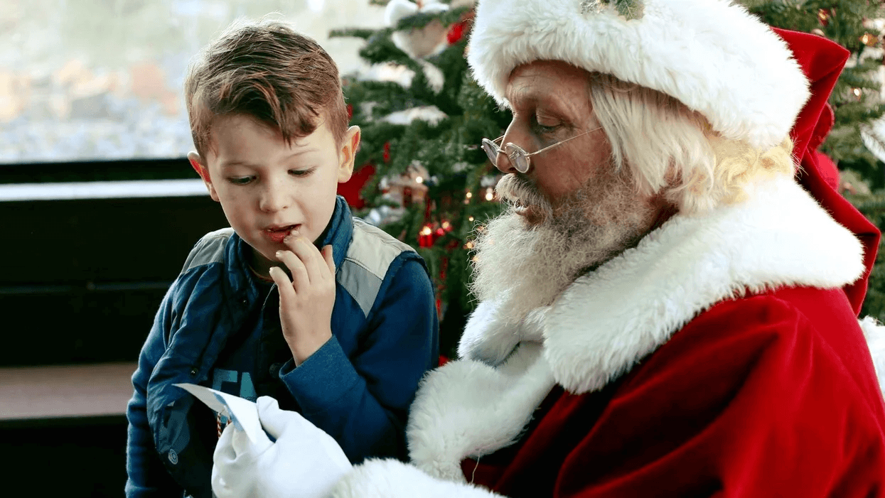 little boy sitting on Santa's lap